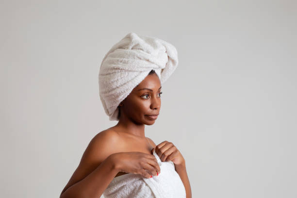 istock Black woman wrapped in a bath towel 2187143293