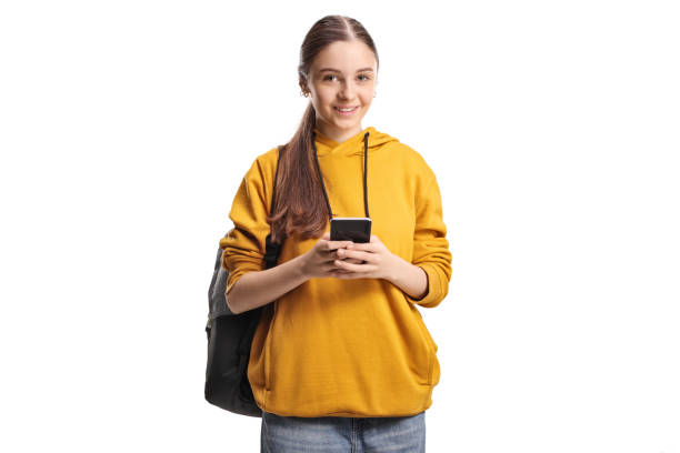 istock Female teenage student using a smartphone and smiling at camera 2187143322