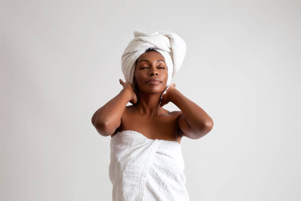 istock Black woman wrapped in a bath towel 2187143329