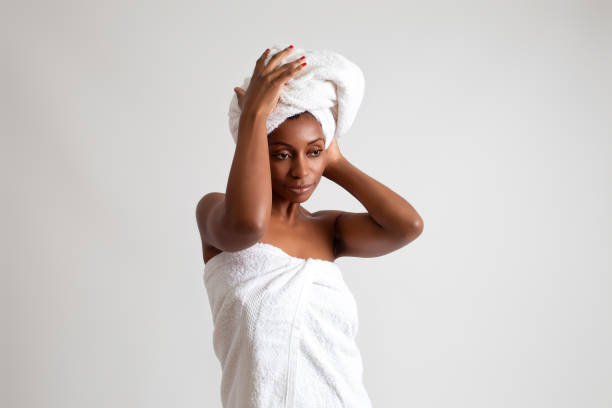 istock Black woman wrapped in a bath towel 2187143333