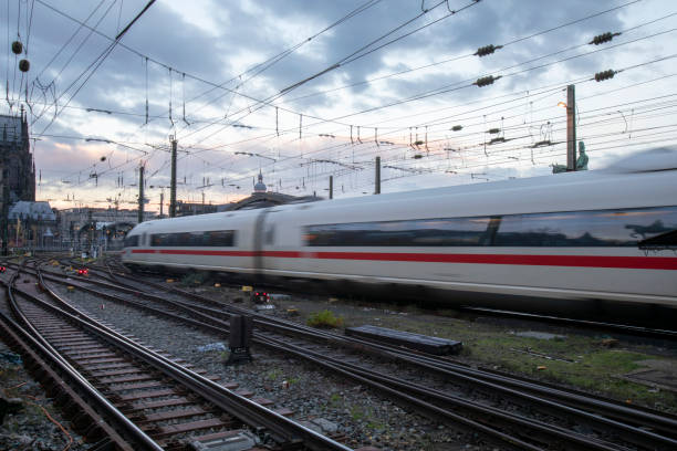 istock Trains arriving at Cologne railway station at dawn with a dramatic sky 2187144641