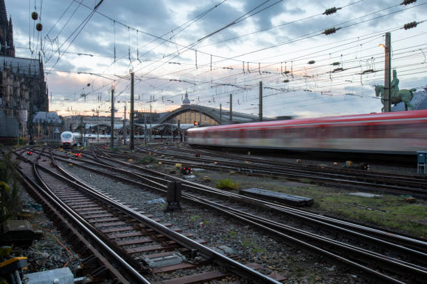 istock Trains arriving at Cologne railway station at dawn with a dramatic sky 2187144670