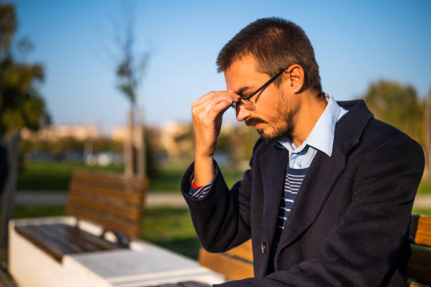 istock Businessman with eyeglasses having a headache 2187147108