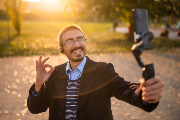 istock Cheerful businessman vlogging outdoor 2187147227