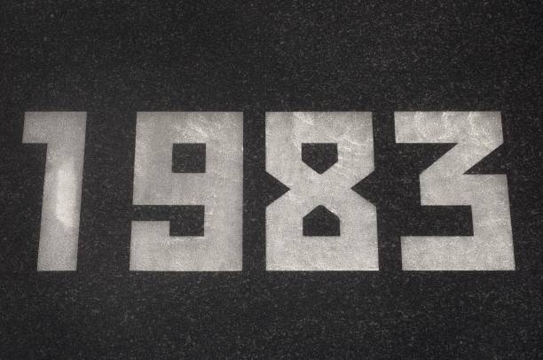 istock Black granite slab with white numbers 1983 on it 2187147375