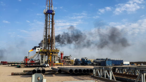 istock Fracking drilling rig in the desert oil field 2187147519