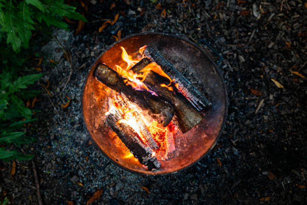 istock A fire burns at night in a barbecue in the forest. 2187147521