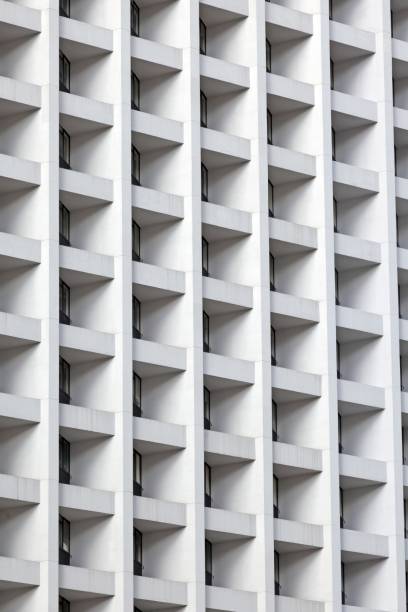 istock Modern high-rise facade with repeating geometric balconies creating a minimal and abstract urban pattern 2187148273
