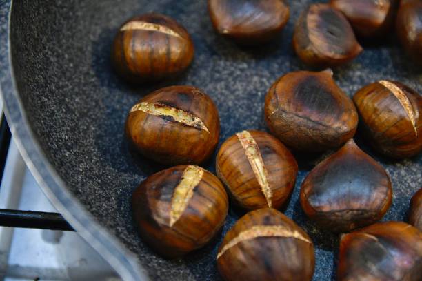 Chestnuts Roasting in a Pan on the Stove – Italian Winter Tradition