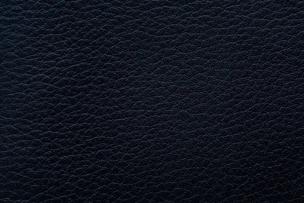 istock Black macro synthetic leather surface,Natural, genuine black leather texture close up, macro. Structure of glossy leatherette, artifical skin surface with embossing pattern. Background, 2187153688