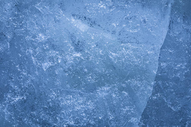 istock Detailed blue ice texture showing intricate pattern with cracks of solid large piece 2187155262
