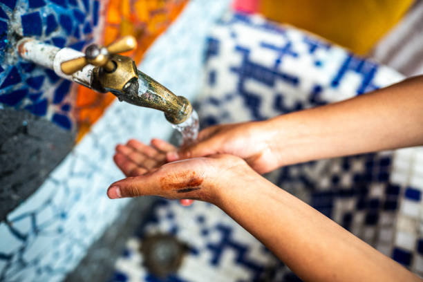 Close-up of a child washing hands