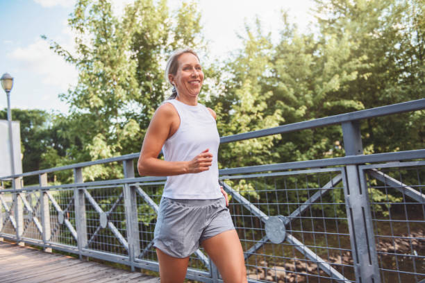 istock great sporty woman jogging outdoors on summer time 2187160612
