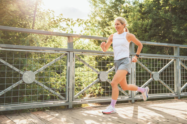 istock great sporty woman jogging outdoors on summer time 2187160626