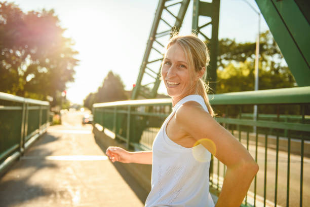 great sporty woman jogging outdoors on sunset time