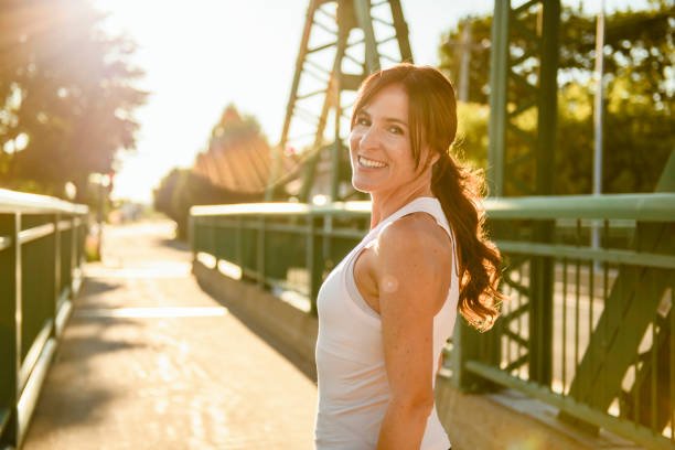 istock great sporty woman jogging outdoors on sunset time 2187160677