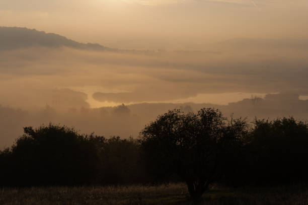 istock Misty valley illuminated by the morning light 2187160947