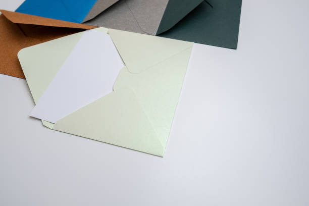 istock Paper envelopes on a light background. New mail, write a message. Send and receive mail. Postal delivery service. Empty envelope, empty space. Communication with people, paperwork. Envelope close-up 2187164078