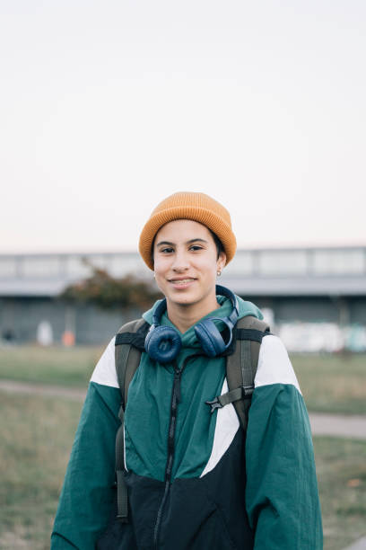 istock Smiling student going back to school wearing headphones and backpack 2187165804