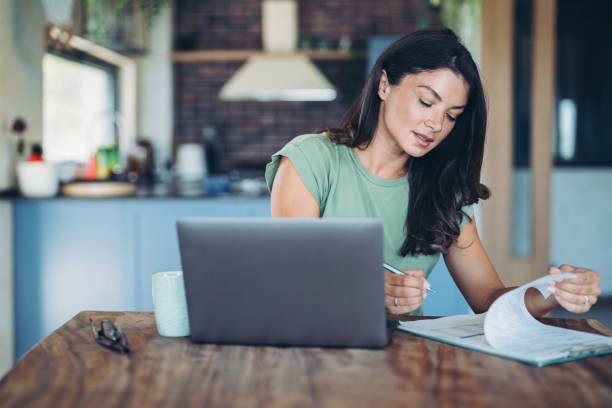 istock Beautiful young woman working at home 2187166170
