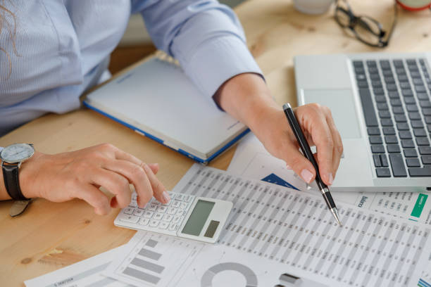 istock Businesswoman financial planning and making accounting database report at workplace 2187167630