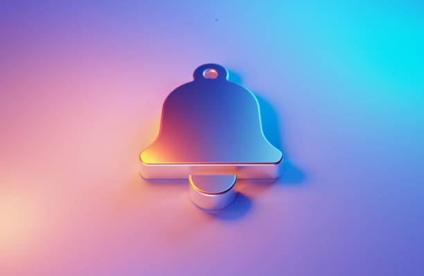 Metallic notification bell symbol illuminated by blue and magenta lights on blue and magenta background. Horizontal composition.