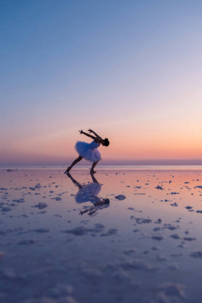 istock Ballerina dancing on salt lake at sunset, creating a stunning reflection 2187173724