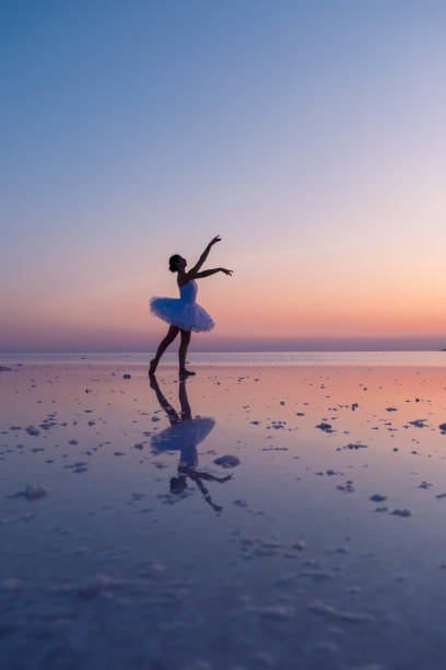 istock Ballerina dancing on salt lake at sunset, creating a stunning reflection 2187173741