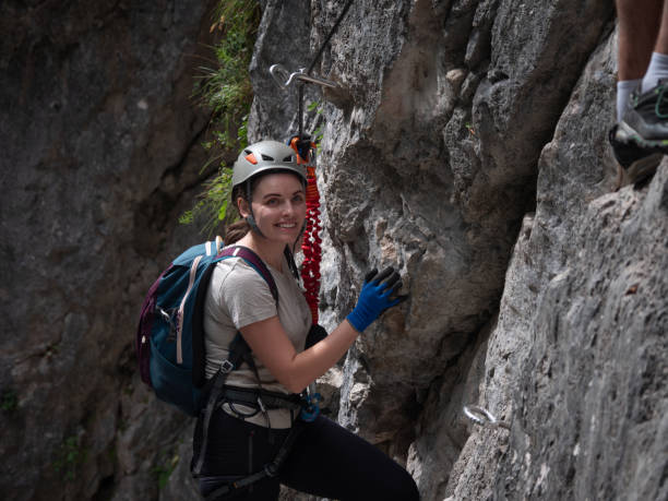 istock A young woman walks along a rock on a via ferrata. 2187173899