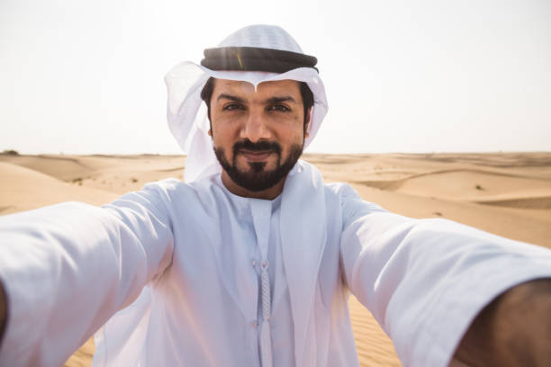 istock sheik man doing a selfie in the desert 2187174664