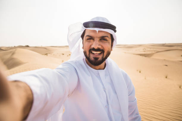 istock sheik man doing a selfie in the desert 2187174695