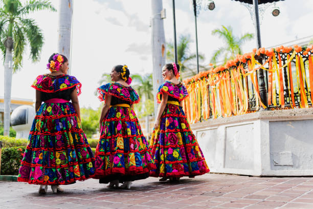 istock Young chiapanecas (traditional mexican dancers) talking outdoors 2187176341