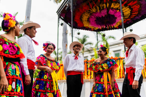 istock Young chiapanecos (traditional mexican dancers) talking outdoors 2187176452