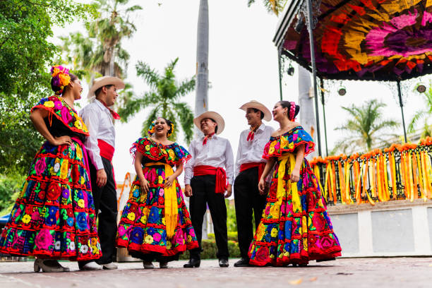 istock Young chiapanecos (traditional mexican dancers) talking outdoors 2187176462