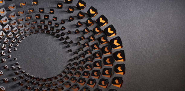 istock Intricate geometric spiral artwork featuring orange and black arrow patterns, created with precision-cut paper design. 2187176467