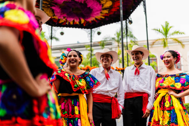 istock Young chiapanecos (traditional mexican dancers) talking outdoors 2187176548