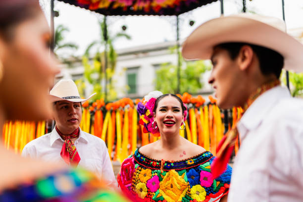istock Young chiapanecos (traditional mexican dancers) talking outdoors 2187176557