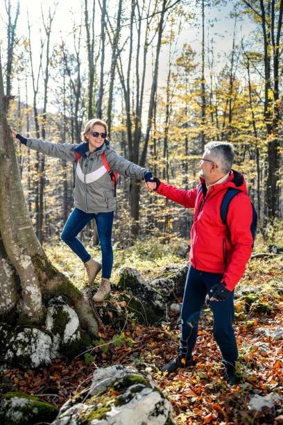 istock Mature couple trekking in the forest 2187176806