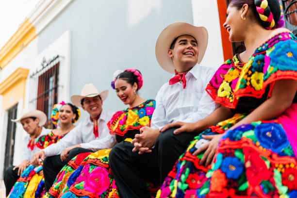 istock Young chiapanecos (traditional mexican dancers) talking outdoors 2187177094