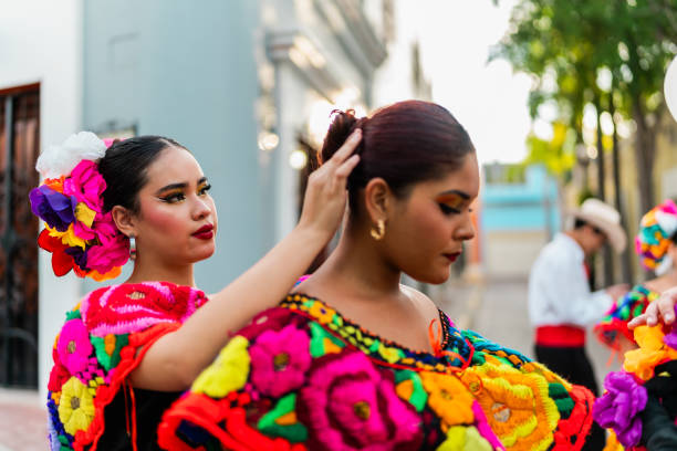 istock Young chiapanecas (traditional mexican dancers) preparing to dancing outdoors 2187177383