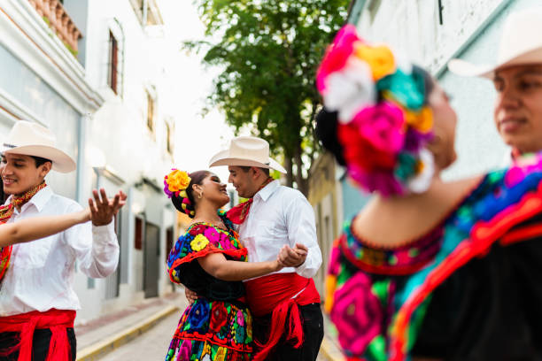 istock Young chiapanecos couple (traditional mexican dancers) dancing outdoors 2187177452