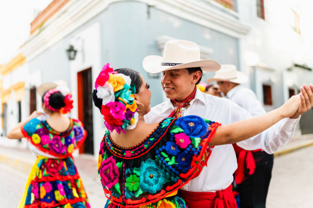 istock Young chiapanecos couple (traditional mexican dancers) dancing outdoors 2187177464