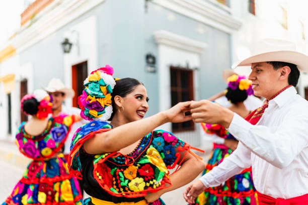 istock Young chiapanecos couple (traditional mexican dancers) dancing outdoors 2187177486