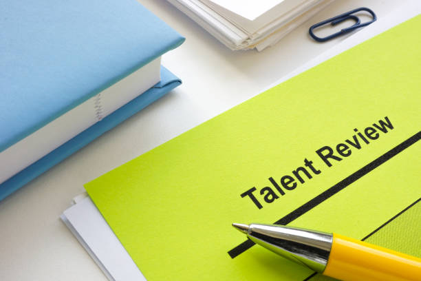 istock Talent review form and a pen. 2187185510