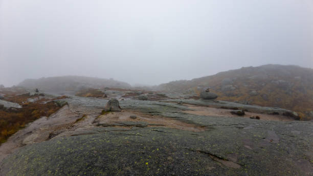 istock Foggy Mountain Landscape with Rocky Terrain 2187186754