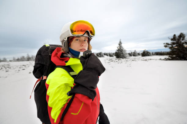 istock Female rescue worker calling for help by using walkie talkie on the mountain 2187187782