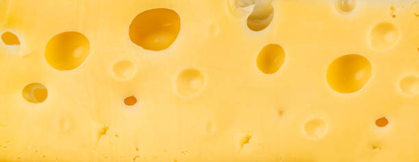istock texture of the cheese holes background, Long banner format 2187187788