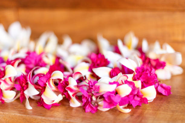 Traditional balinese offerings to gods in Bali with flowers and aromatic sticks
