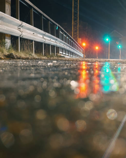 Close up of a wet road during night