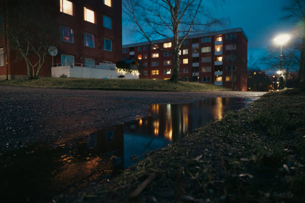 istock Close up of a puddle on a street during night 2187190398